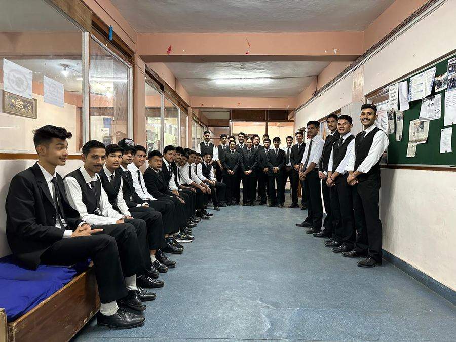 BIHM students lined up in uniform, corridor view 2